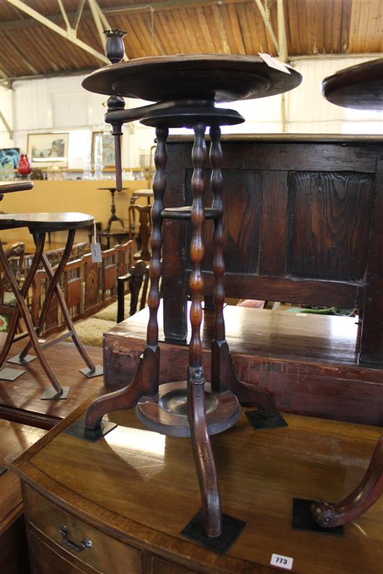 Victorian carved edge circular tilt-top table, fitted turned candlestick with brass sconce